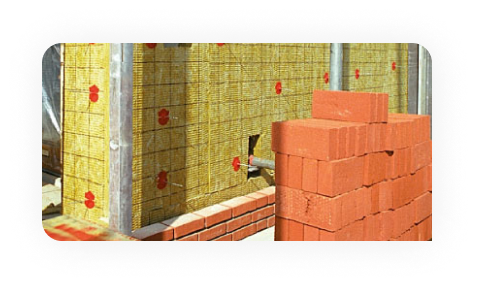 Worker drawing on plans